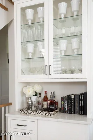 a bunch of bottles sitting on a shelf