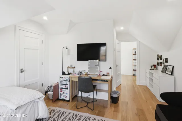 a view of a livingroom with furniture and a flat screen tv