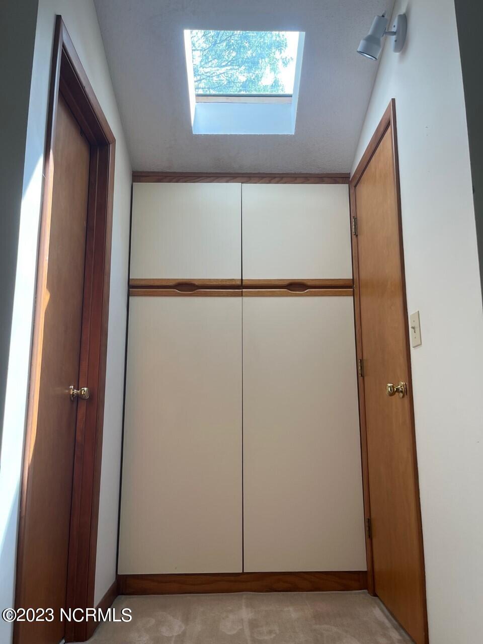 402 Ravenswood Road Hampstead, NC 28443 - Photo 64 of 130 Primary Bedroom Closet 1