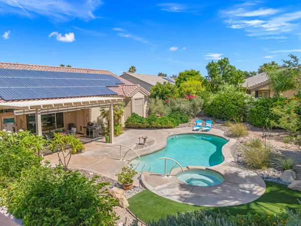 a view of a swimming pool with a patio