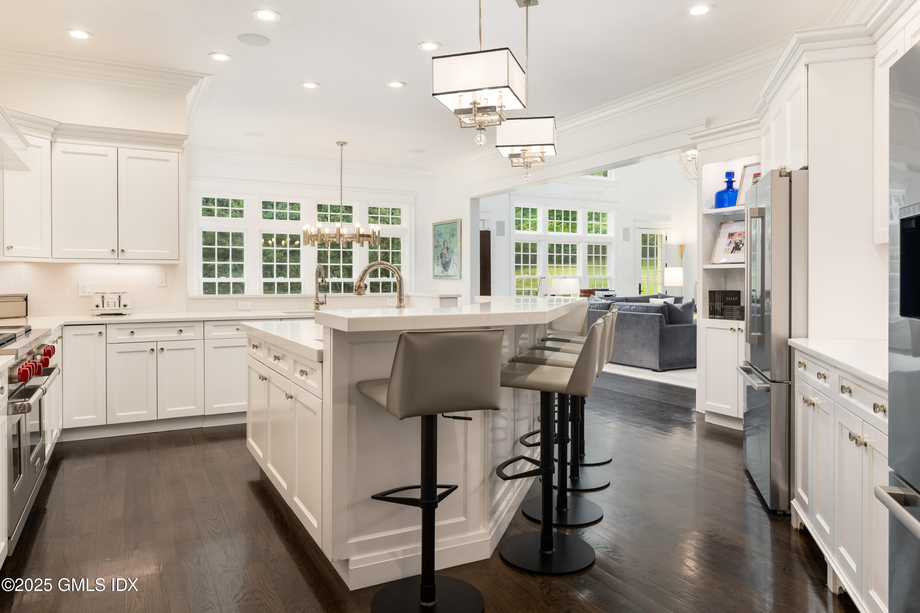 28 Thunder Mountain Road Greenwich, CT 06831 - Photo 13 of 32 a kitchen with stainless steel appliances a stove a sink dishwasher a refrigerator and a dining table with wooden floor