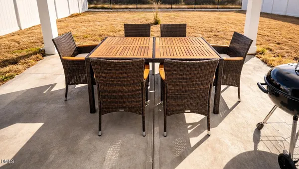 a dining room with furniture and window