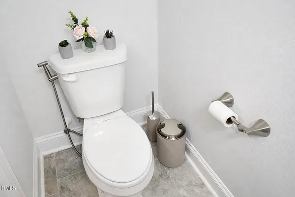 a kitchen with stainless steel appliances granite countertop a stove a microwave and a white cabinets