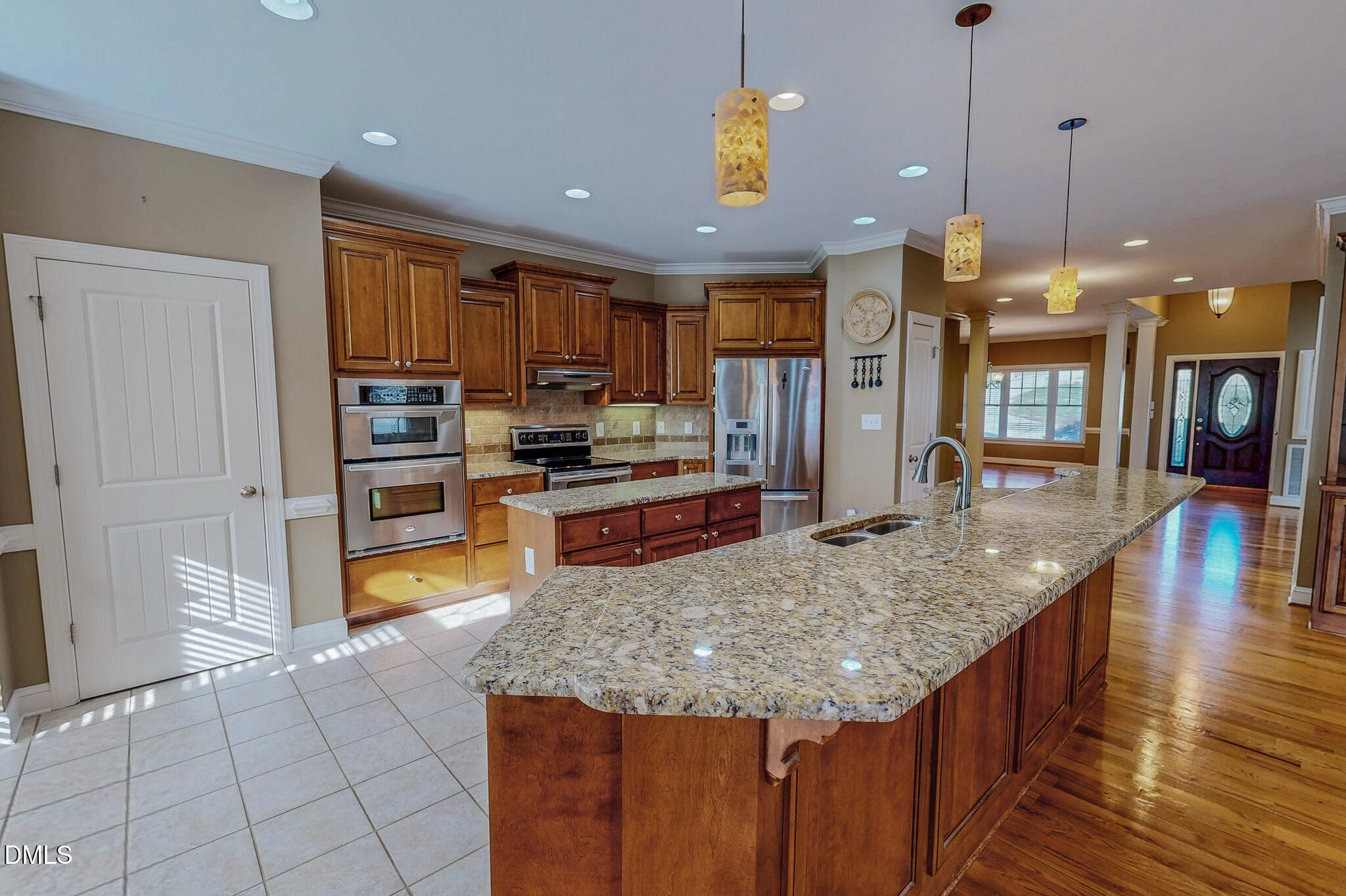 84 MacBeth Lane Roxboro, NC 27574 - Photo 18 of 64 a kitchen with stainless steel appliances granite countertop a stove and refrigerator