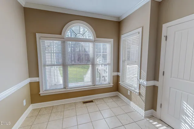 a bathroom with a granite countertop shower a sink and a mirror