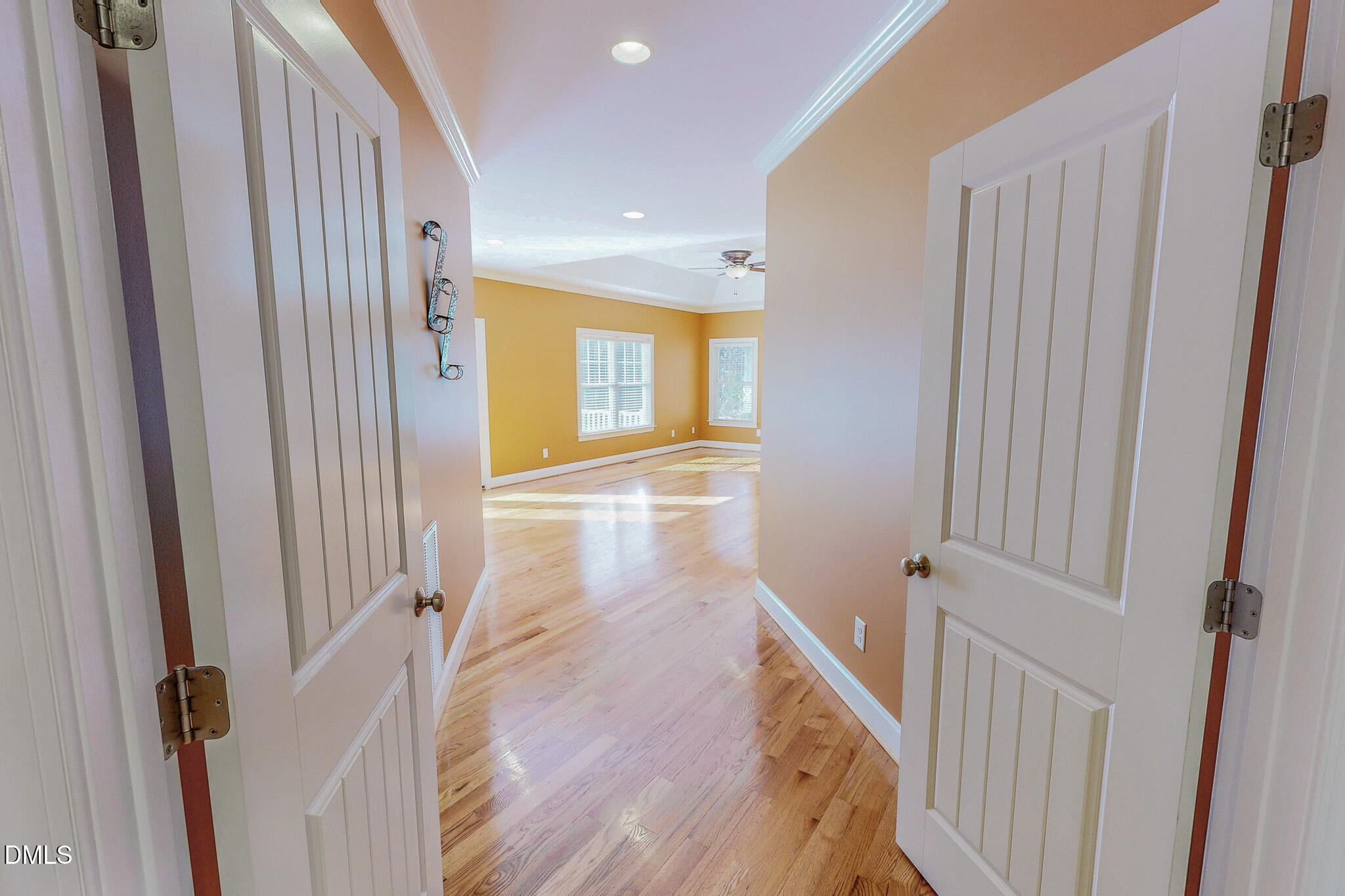 84 MacBeth Lane Roxboro, NC 27574 - Photo 21 of 64 a view of a hallway with wooden floor and staircase