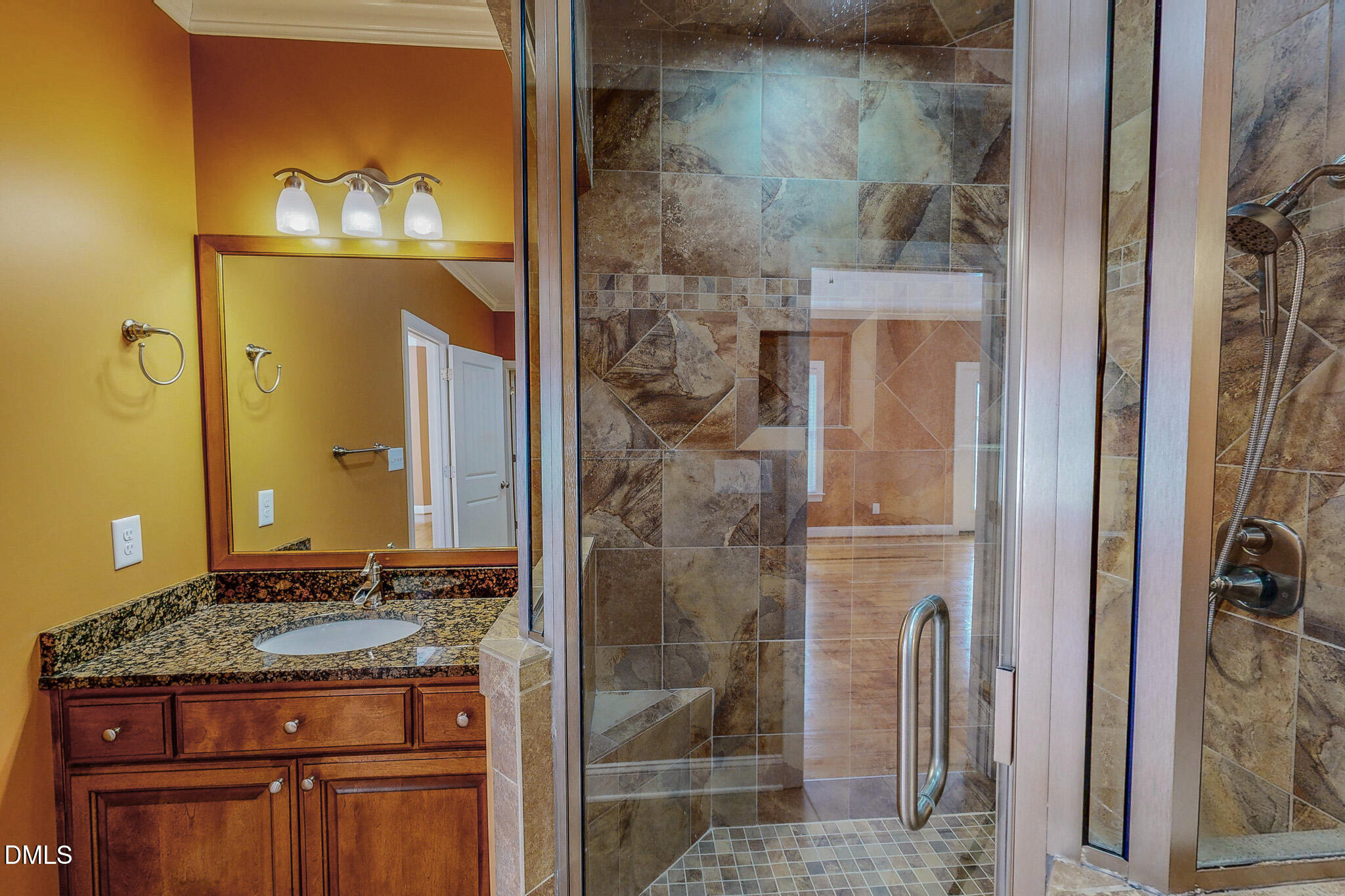 84 MacBeth Lane Roxboro, NC 27574 - Photo 27 of 64 a bathroom with a granite countertop shower a sink and a mirror
