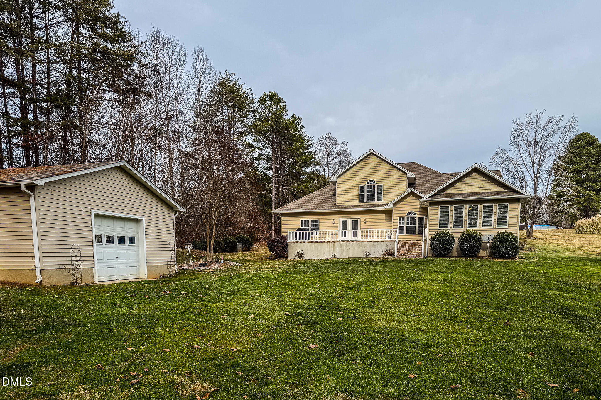 84 MacBeth Lane Roxboro, NC 27574 - Photo 38 of 64 a view of a house with a big yard and large trees