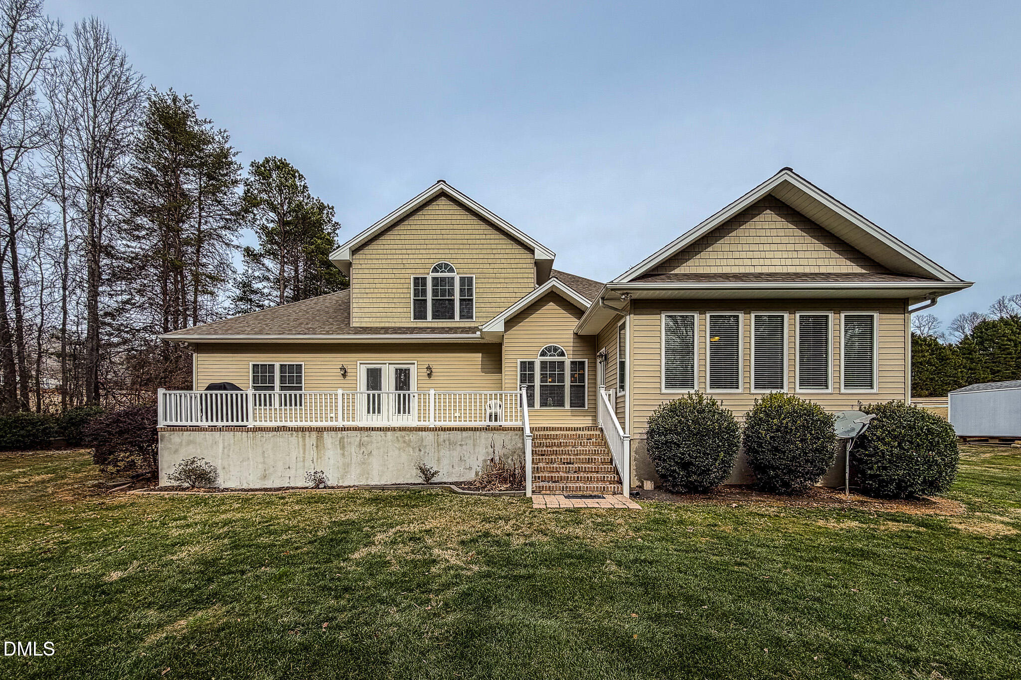 84 MacBeth Lane Roxboro, NC 27574 - Photo 39 of 64 a house with green field in front of it