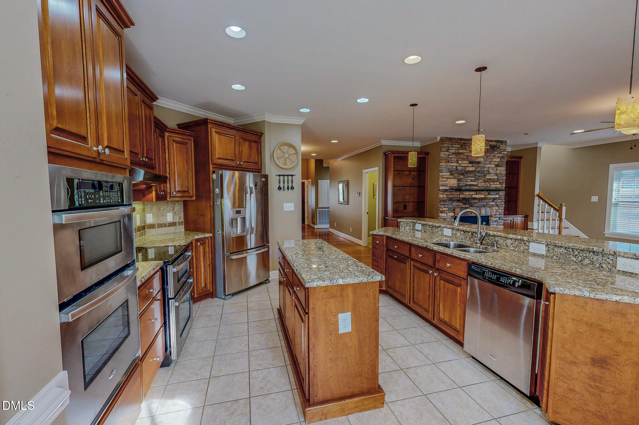 84 MacBeth Lane Roxboro, NC 27574 - Photo 43 of 64 a kitchen with stainless steel appliances granite countertop a stove and a refrigerator