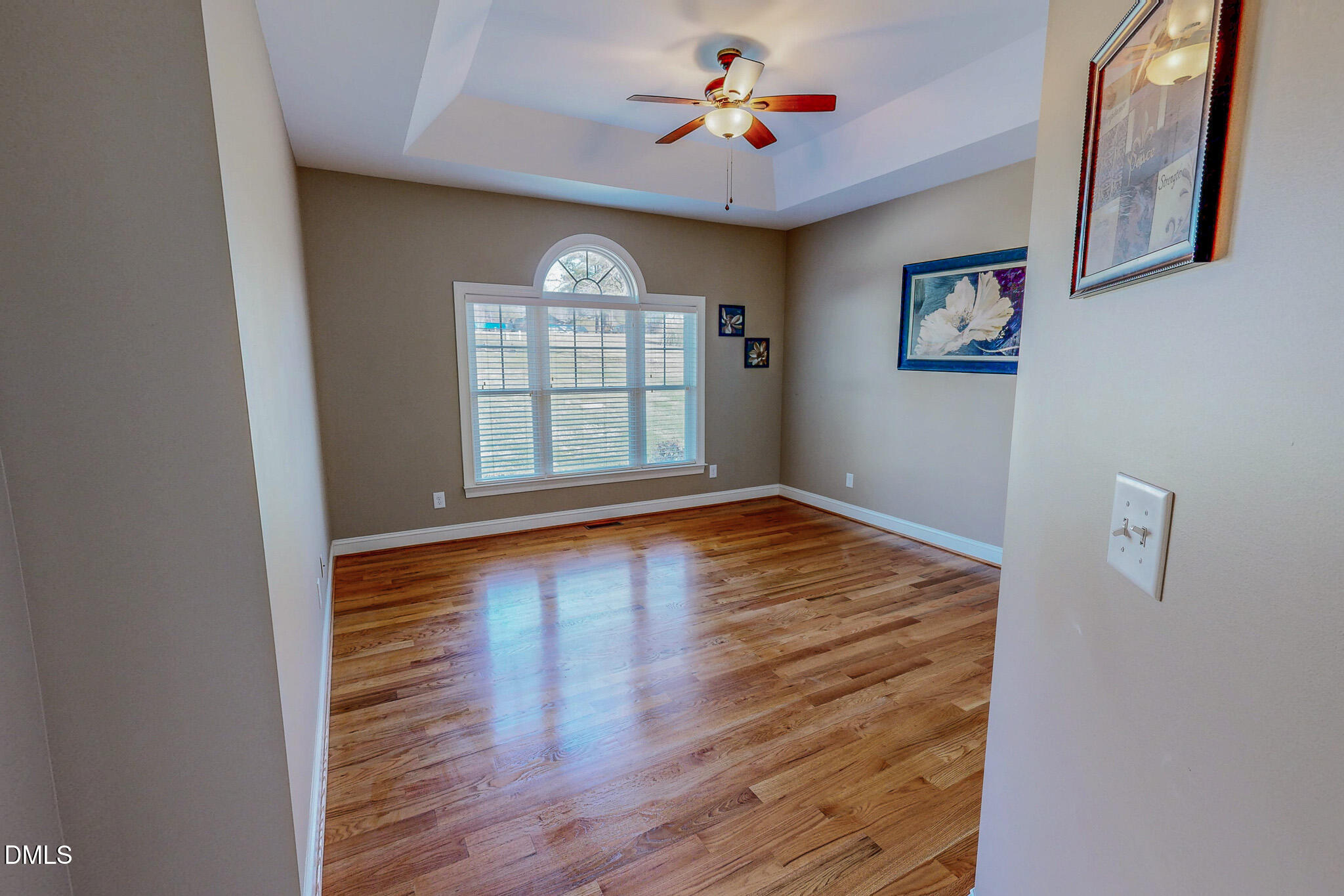 84 MacBeth Lane Roxboro, NC 27574 - Photo 47 of 64 an empty room with wooden floor and windows