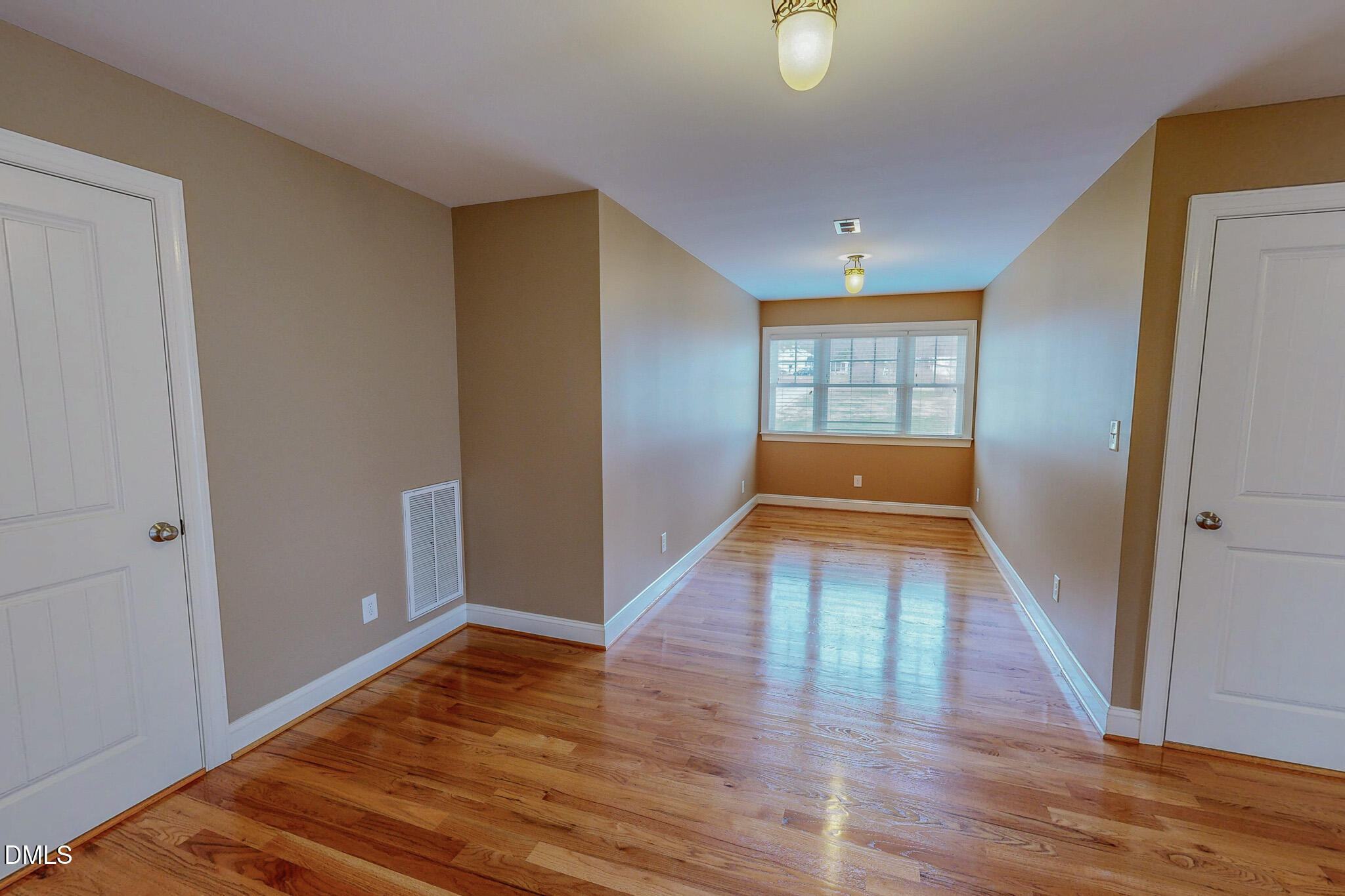 84 MacBeth Lane Roxboro, NC 27574 - Photo 55 of 64 wooden floor in an empty room with a window