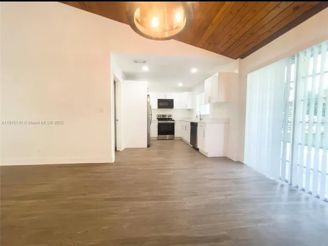 a view of a livingroom with furniture and a fireplace