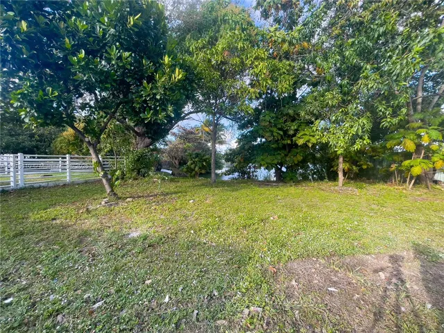 a view of lake with houses in back