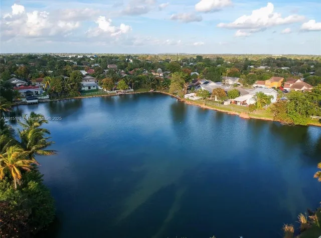an aerial view of a houses with ocean view