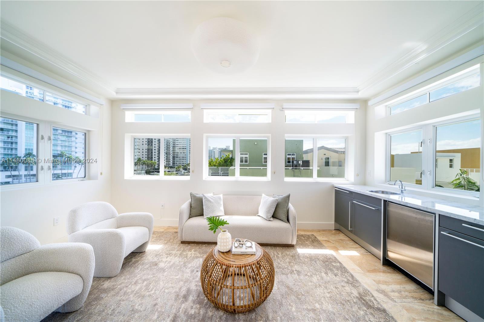 6010 Aqua Path Miami Beach, FL 33141 - Photo 33 of 65 a living room with furniture and a large window