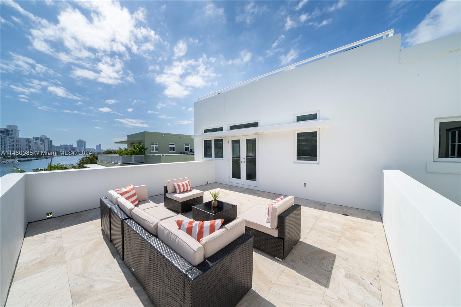 6010 Aqua Path Miami Beach, FL 33141 - Photo 35 of 65 a outdoor living space with furniture and city view