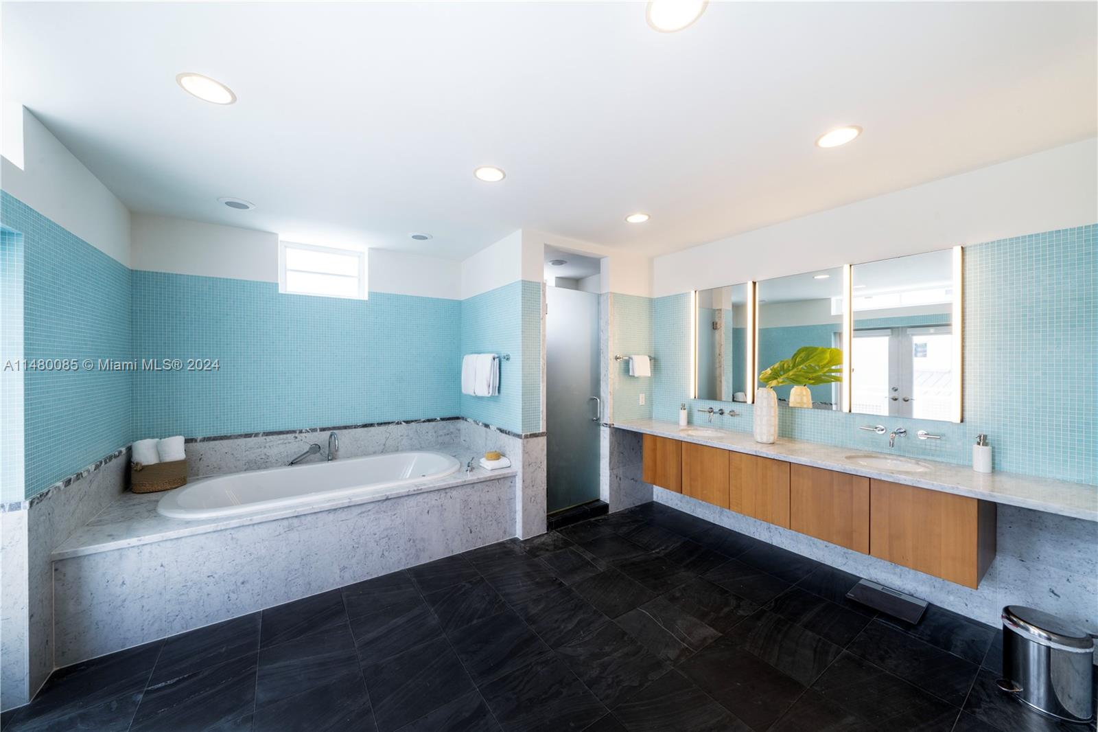 6010 Aqua Path Miami Beach, FL 33141 - Photo 41 of 65 a bathroom with a sink and a bathtub