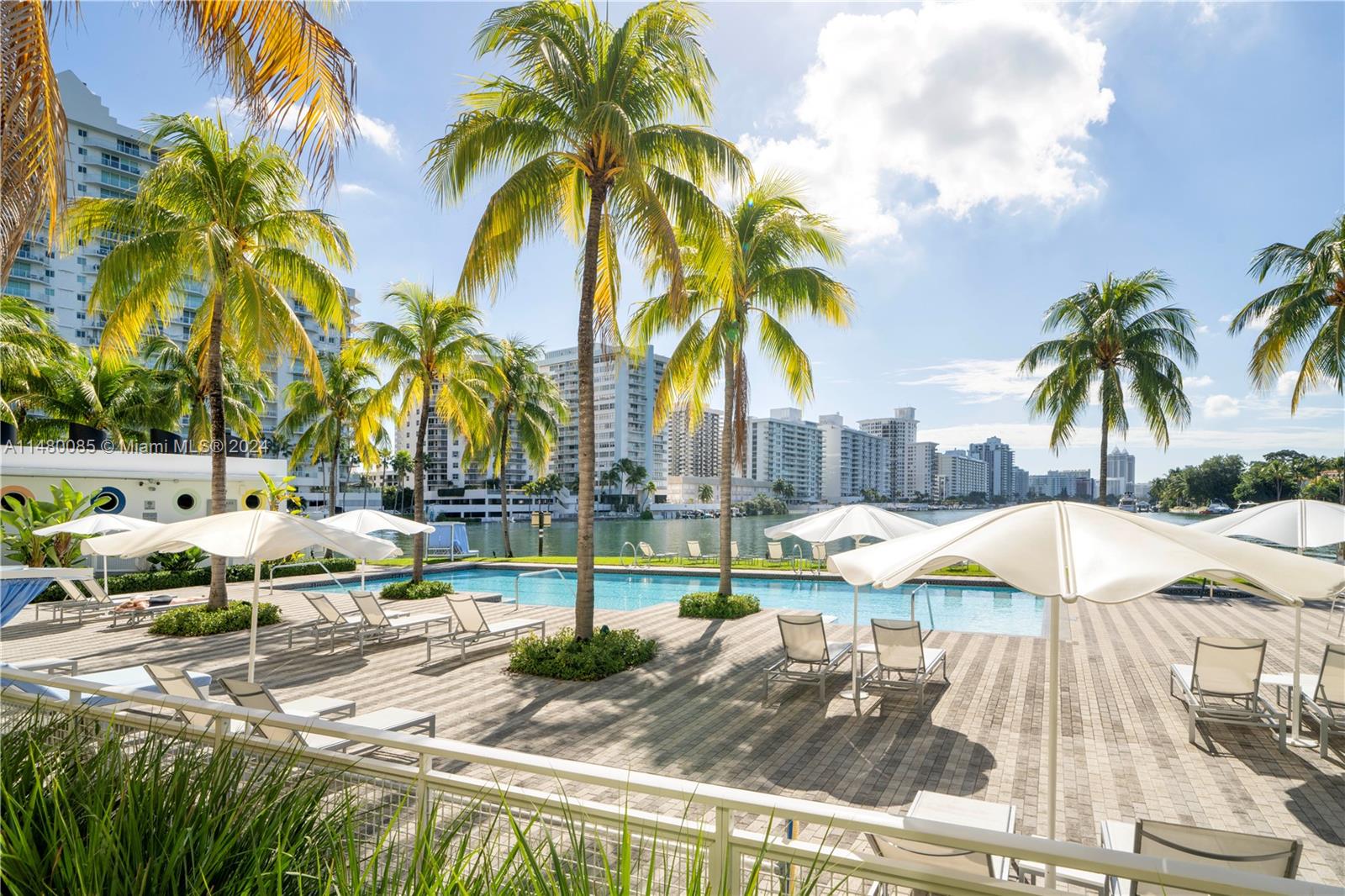6010 Aqua Path Miami Beach, FL 33141 - Photo 46 of 65 a view of an ocean with palm trees