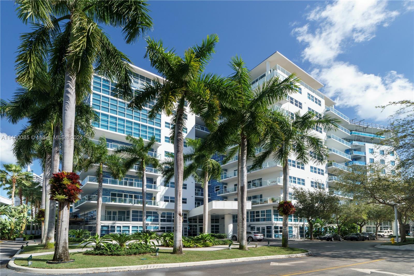 6010 Aqua Path Miami Beach, FL 33141 - Photo 53 of 65 a view of a city street lined with buildings and trees