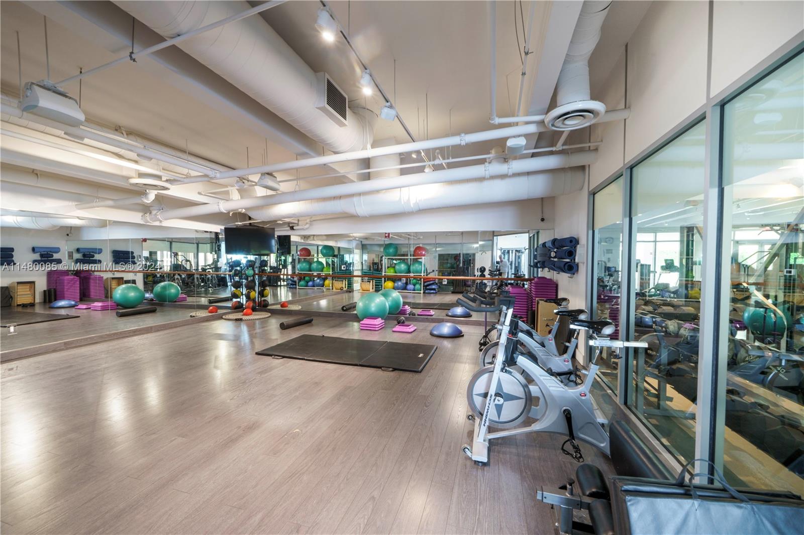 6010 Aqua Path Miami Beach, FL 33141 - Photo 56 of 65 a view of a room with gym equipment