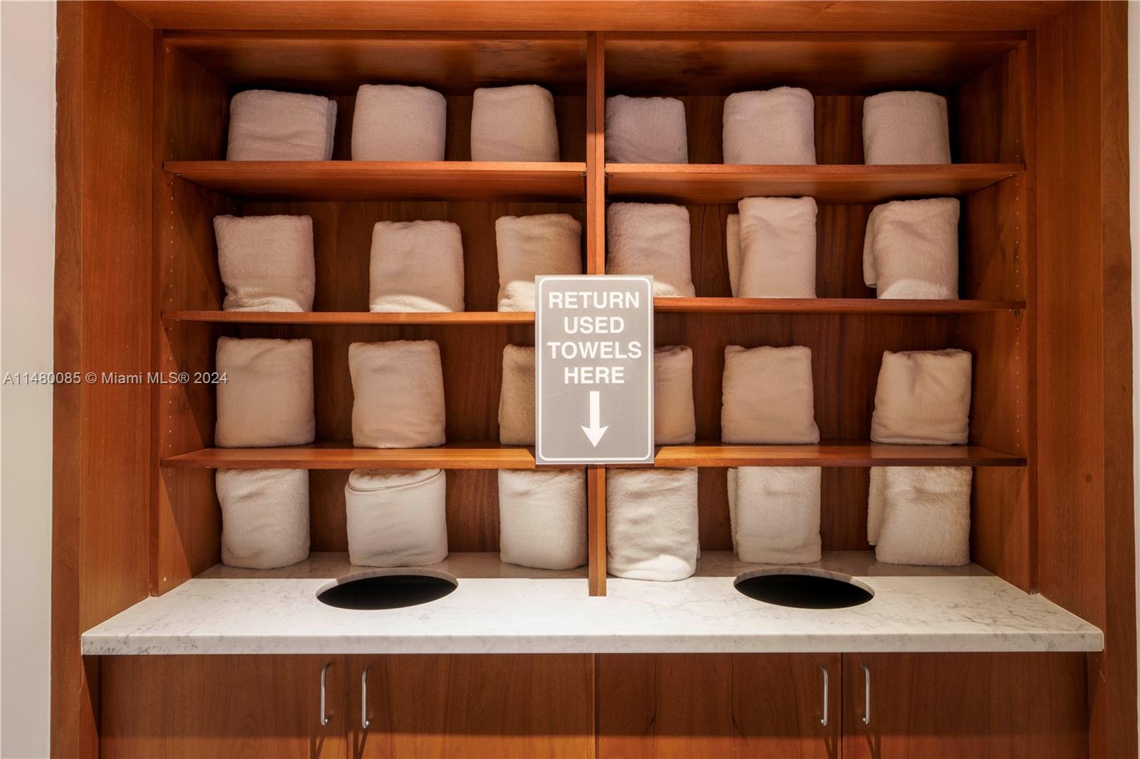 6010 Aqua Path Miami Beach, FL 33141 - Photo 58 of 65 a cabinet with two white chairs