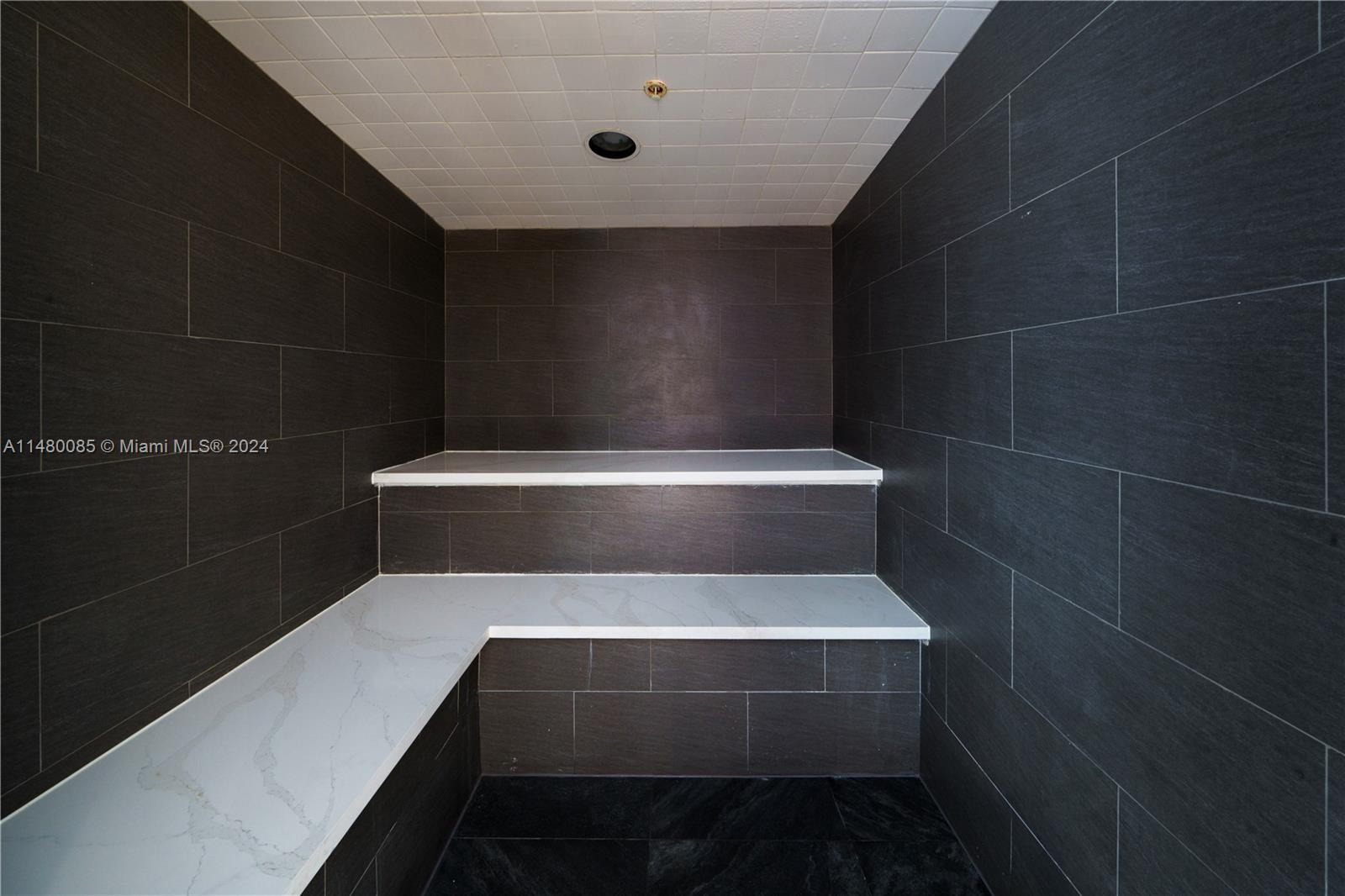 6010 Aqua Path Miami Beach, FL 33141 - Photo 60 of 65 a bathroom with a toilet and a sink