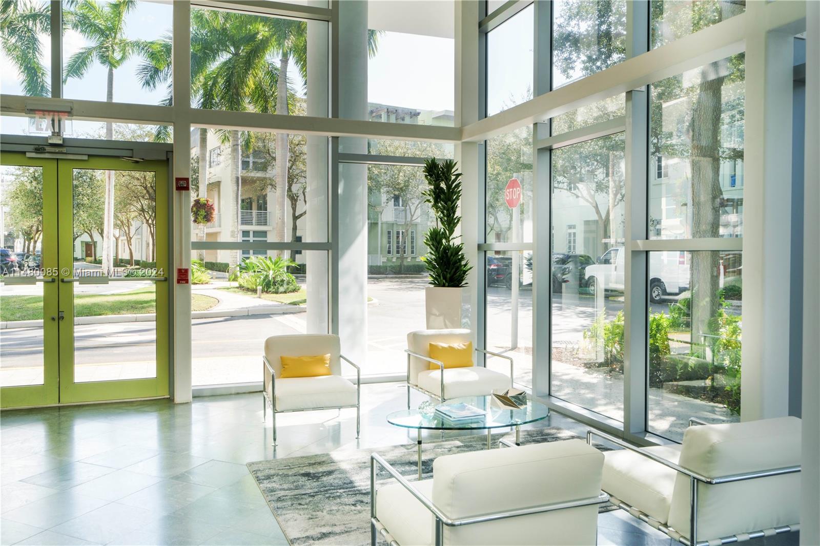6010 Aqua Path Miami Beach, FL 33141 - Photo 62 of 65 a living room with furniture and floor to ceiling windows