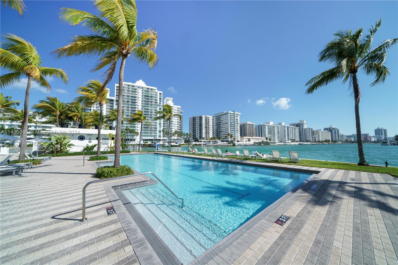 6010 Aqua Path Miami Beach, FL 33141 - Photo 65 of 65 a view of swimming pool with outdoor seating and city view
