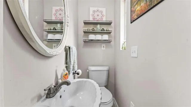 a bathroom with a toilet and a sink