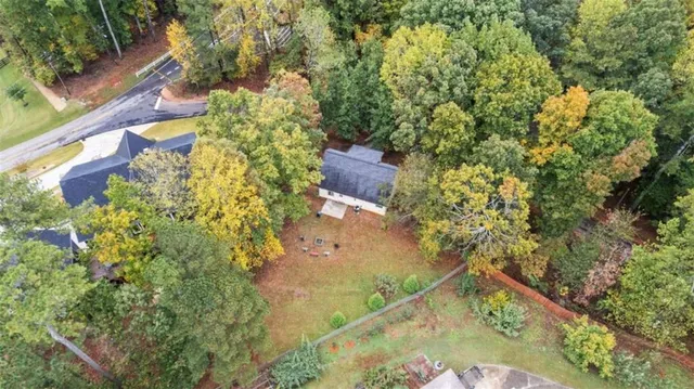 view of a lake with large trees