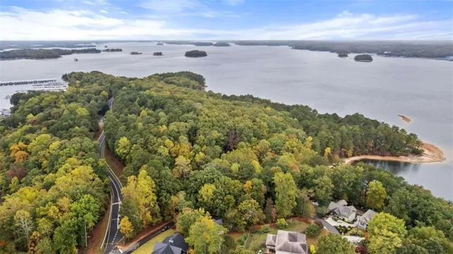 a view of a lake with houses in the back
