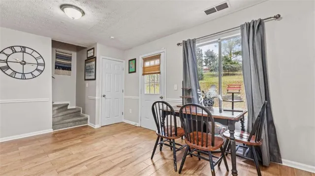 a view of a dining room with furniture window and outside view