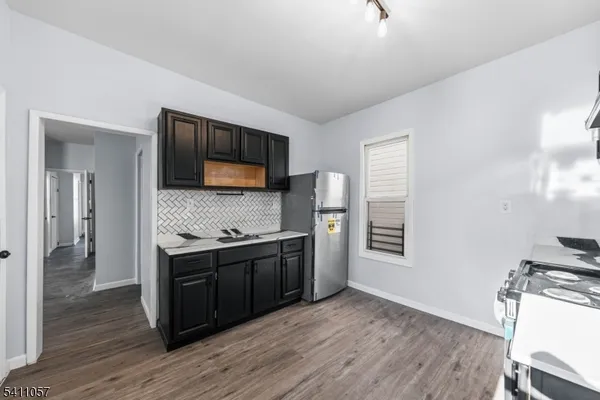 a kitchen with stainless steel appliances granite countertop a stove and a sink