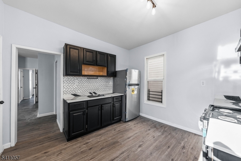 629 Magnolia Avenue Elizabeth Port, NJ 07206 - Photo 15 of 24 a kitchen with stainless steel appliances granite countertop a stove and a sink