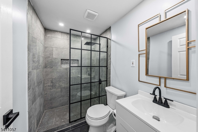 629 Magnolia Avenue Elizabeth Port, NJ 07206 - Photo 20 of 24 a bathroom with a toilet sink and shower