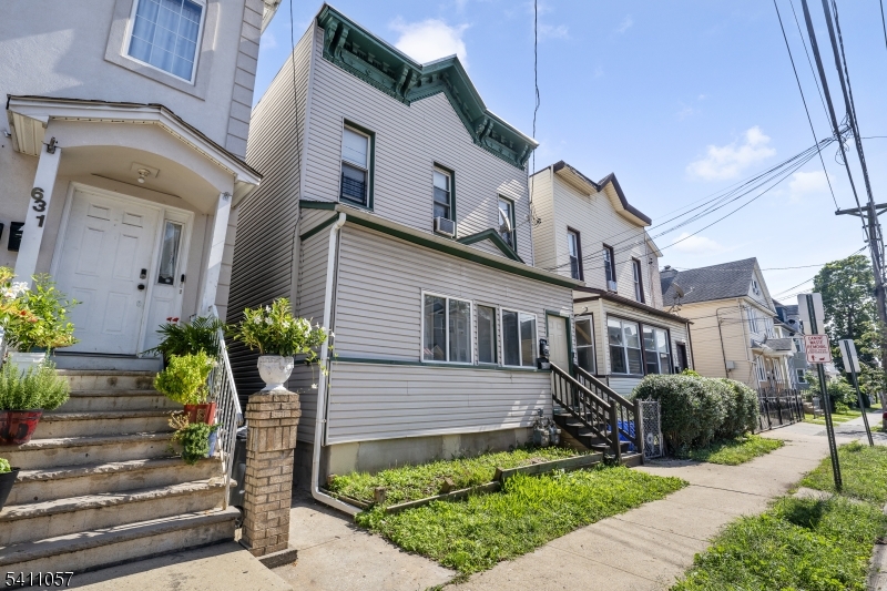 629 Magnolia Avenue Elizabeth Port, NJ 07206 - Photo 2 of 24 a front view of a house with garden