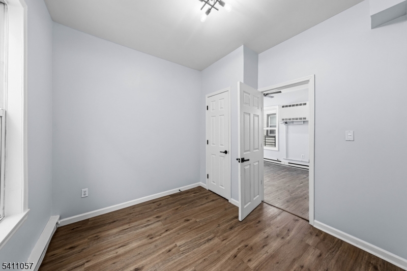 629 Magnolia Avenue Elizabeth Port, NJ 07206 - Photo 21 of 24 wooden floor in an empty room