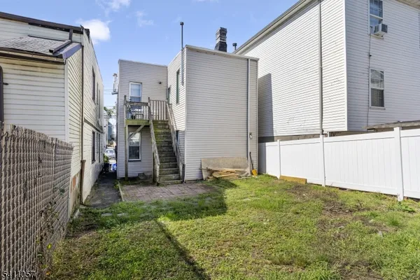 a view of a back yard of the house