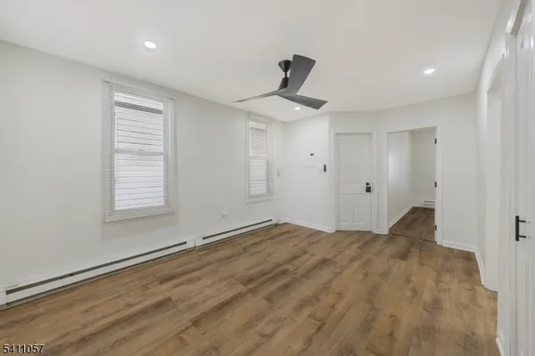 a view of empty room with ceiling fan