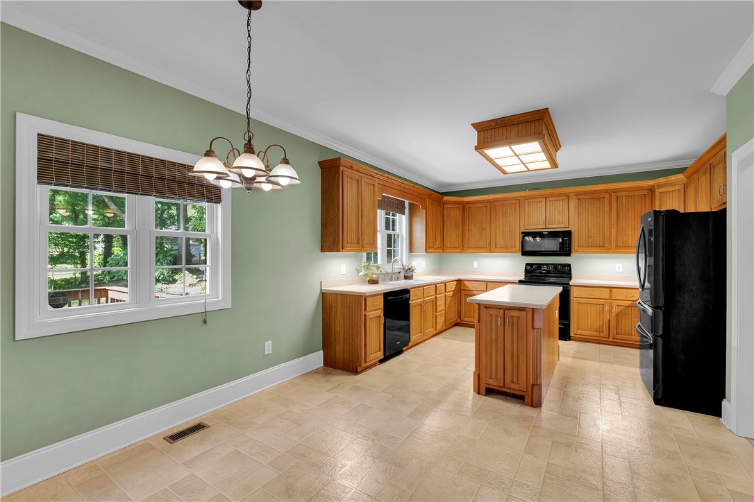 406 Hopewell Ridge Anderson, SC 29621 - Photo 9 of 46 This spacious kitchen offers ample cabinetry, modern appliances, and a functional island for culinary pursuits.