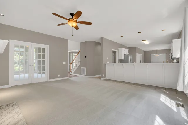 a kitchen with cabinets stainless steel appliances and a sink