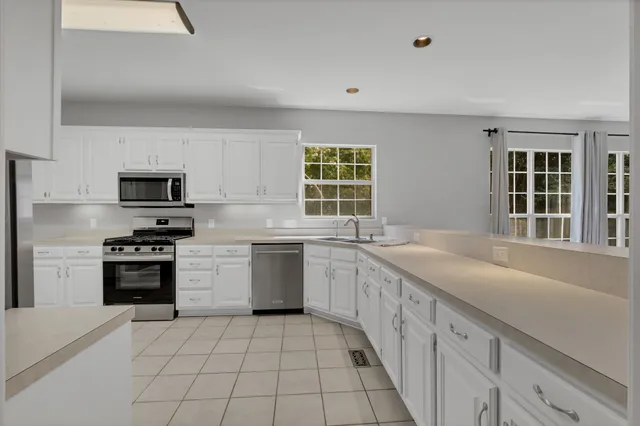 a bathroom with a bathtub and window