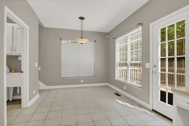 an aerial view of a house with outdoor space and a lake view