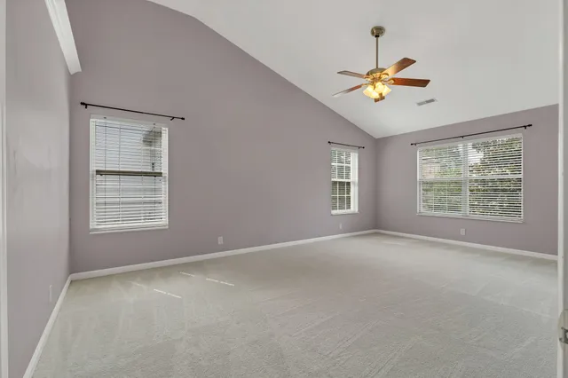 a backyard of a house with outdoor seating water fountain and a lake view