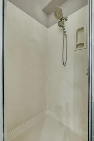 an aerial view of a houses with a yard and lake view