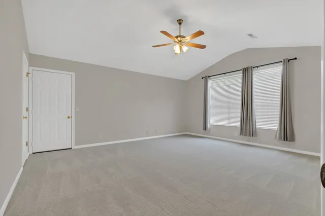 an aerial view of a city with mountains