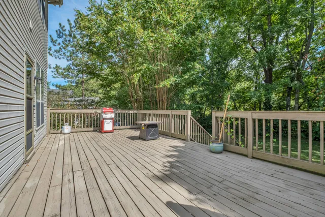 an aerial view of a city with lots of residential buildings and mountain view in back