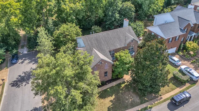a brick building with a yard