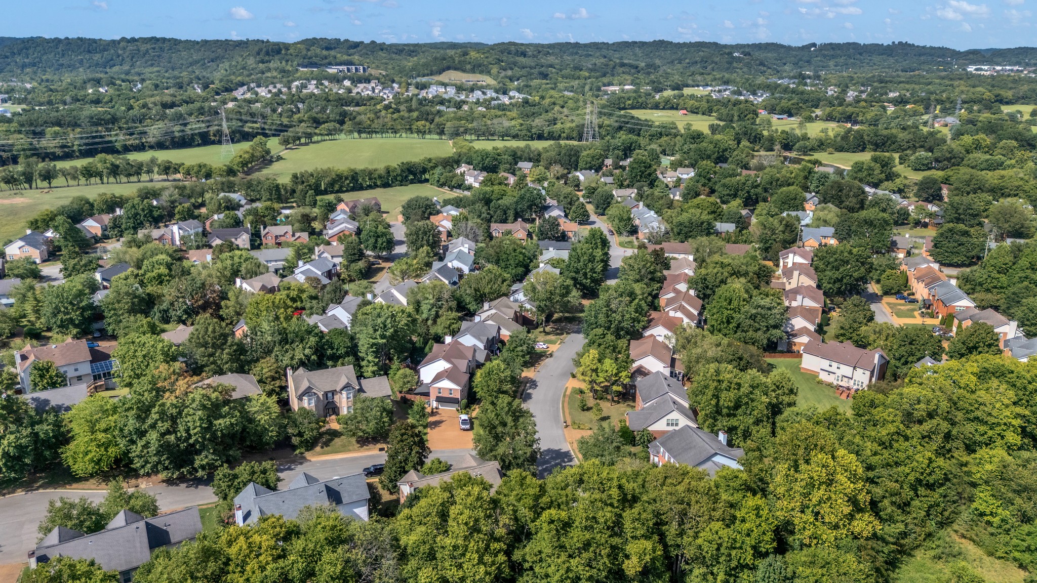 8169 Londonberry Road Nashville, TN 37221 - Photo 81 of 82 an aerial view of residential houses with outdoor space and trees